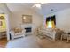 Cozy living room with vaulted ceiling, marble fireplace, neutral decor and comfortable seating at 40 Oak Hill Dr, Covington, GA 30016