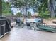Relaxing backyard patio with comfortable seating, stone pavers, and ambient string lights at 708 Hanover Se Ln, Marietta, GA 30067