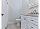 A bright bathroom with granite countertops, new fixtures, and white cabinets at 708 Hanover Se Ln, Marietta, GA 30067