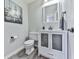 Modern bathroom with stylish vanity, mirrored cabinet, and contemporary fixtures at 708 Hanover Se Ln, Marietta, GA 30067
