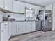Modern kitchen featuring stainless steel appliances, white cabinets, and granite countertops at 708 Hanover Se Ln, Marietta, GA 30067