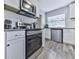 Well-equipped kitchen with stainless steel appliances, ample counter space, and modern finishes at 708 Hanover Se Ln, Marietta, GA 30067
