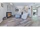 Charming living room with a fireplace and comfortable seating area at 708 Hanover Se Ln, Marietta, GA 30067