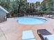 A sunny pool with lounge chairs and a pergola in a fenced-in area at 708 Hanover Se Ln, Marietta, GA 30067
