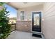 Inviting front entrance featuring a stylish black door, brick accents, and a cozy covered porch area at 2528 Shropshire Pl, Mcdonough, GA 30253