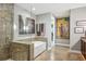 Elegant bathroom featuring tiled walls, a glass-enclosed shower, and a luxurious soaking tub for a spa-like experience at 270 17Th Nw St # 3606, Atlanta, GA 30363