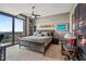 Spacious bedroom with floor-to-ceiling windows, offering natural light and city views, paired with stylish modern furnishings at 270 17Th Nw St # 3606, Atlanta, GA 30363