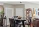 A modern dining area featuring a dark table with black chairs and unique decor at 270 17Th Nw St # 3606, Atlanta, GA 30363