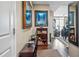 An entryway into a home featuring a long hallway with art, a console table, and views of the living area at 270 17Th Nw St # 3606, Atlanta, GA 30363