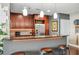 Kitchen featuring bar seating, stainless steel appliances, granite countertops, and pendant lighting at 270 17Th Nw St # 3606, Atlanta, GA 30363
