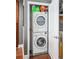 Efficient laundry closet with stacked washer and dryer unit at 270 17Th Nw St # 3606, Atlanta, GA 30363