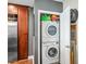 Convenient laundry closet with stacked washer and dryer, and storage space at 270 17Th Nw St # 3606, Atlanta, GA 30363