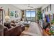 Spacious living room with hardwood floors, modern furnishings, and expansive windows offering scenic views at 270 17Th Nw St # 3606, Atlanta, GA 30363