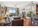 Bright living space boasting hardwood floors, comfortable seating, city views and plants at 270 17Th Nw St # 3606, Atlanta, GA 30363