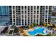 Exterior building view with a swimming pool, lounge chairs and cabanas on a sunny day at 270 17Th Nw St # 3606, Atlanta, GA 30363