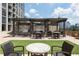 Rooftop terrace with stone accents, a built-in grill, ample seating, and well-manicured landscaping at 270 17Th Nw St # 3606, Atlanta, GA 30363