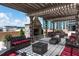 Inviting rooftop terrace featuring a stone fireplace, comfortable seating, and scenic city views at 270 17Th Nw St # 3606, Atlanta, GA 30363