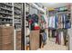 Organized walk-in closet with custom shelving and ample storage space for clothes, shoes, and accessories at 270 17Th Nw St # 3606, Atlanta, GA 30363