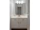Bathroom with white vanity, drawers, and framed mirror at 421 Congress Pkwy, Lawrenceville, GA 30044