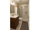 Bathroom featuring a shower, modern vanity, and tiled flooring at 421 Congress Pkwy, Lawrenceville, GA 30044