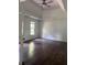 Spacious bedroom with ceiling fan, recessed lighting, and large window at 421 Congress Pkwy, Lawrenceville, GA 30044