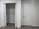 Walk-in closet and door featuring light walls and wood-style floors at 421 Congress Pkwy, Lawrenceville, GA 30044