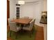 Bright dining room with hardwood floors, large window, and bright lighting at 421 Congress Pkwy, Lawrenceville, GA 30044