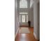 Inviting foyer with gleaming hardwood floors, stained-glass door, and staircase at 421 Congress Pkwy, Lawrenceville, GA 30044