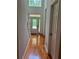 Bright foyer with hardwood floors and a glass front door, adding elegance to the home at 421 Congress Pkwy, Lawrenceville, GA 30044