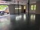 Spacious two car garage featuring an epoxy floor and abundant natural light at 421 Congress Pkwy, Lawrenceville, GA 30044