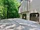 Home's two car garage featuring a large parking area at 421 Congress Pkwy, Lawrenceville, GA 30044