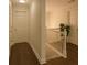 A bright hallway features wooden floors, white walls, a plant, and multiple doors at 421 Congress Pkwy, Lawrenceville, GA 30044
