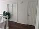 A bright hallway featuring wooden floors, white doors, white walls, and a plant at 421 Congress Pkwy, Lawrenceville, GA 30044