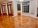 The hardwood floors compliment the room and fill it with light from the windows at 421 Congress Pkwy, Lawrenceville, GA 30044