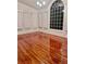 Living room with large windows showing off the hardwood flooring and natural light at 421 Congress Pkwy, Lawrenceville, GA 30044