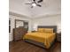 Comfortable main bedroom featuring a ceiling fan, recessed lighting, and two windows for plenty of natural light at 421 Congress Pkwy, Lawrenceville, GA 30044