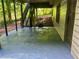 Outdoor patio with stairs leading to the upper level, offering a private and shaded space at 421 Congress Pkwy, Lawrenceville, GA 30044