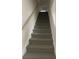 Carpeted staircase features neutral tones and provides access to the upper level of the home at 421 Congress Pkwy, Lawrenceville, GA 30044