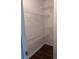 A walk-in closet features wire shelving, ample space, and dark flooring at 421 Congress Pkwy, Lawrenceville, GA 30044