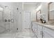 Luxurious bathroom features a tiled shower, dual sinks, and granite countertops at 553 Onyx Lndg, Marietta, GA 30064