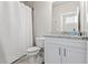 Clean bathroom with a vanity, toilet, and shower with a curtain at 553 Onyx Lndg, Marietta, GA 30064