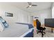 Bright bedroom features neutral walls, carpet, ceiling fan, comfortable bed, and workspace at 553 Onyx Lndg, Marietta, GA 30064