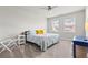 Bright bedroom with neutral carpet, ceiling fan, and two windows allowing for ample natural light at 553 Onyx Lndg, Marietta, GA 30064