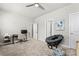 Bright and airy bedroom offering a comfortable sitting area and desk space at 553 Onyx Lndg, Marietta, GA 30064