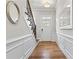 Elegant entryway with a staircase, white trim, and hardwood flooring creating a welcoming ambiance at 553 Onyx Lndg, Marietta, GA 30064
