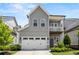 Lovely two-story home with gray siding, white trim, a spacious garage, and a welcoming front porch at 553 Onyx Lndg, Marietta, GA 30064