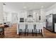 Modern kitchen with stainless steel appliances, granite countertops, an island with seating, and hardwood floors at 553 Onyx Lndg, Marietta, GA 30064