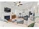 Spacious open-concept living room with hardwood floors, fireplace, and seamless connection to the kitchen at 553 Onyx Lndg, Marietta, GA 30064