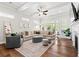 Bright and open living room with hardwood floors, a fireplace, comfortable seating, and ample natural light at 553 Onyx Lndg, Marietta, GA 30064
