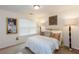 Bright bedroom with a white comforter, decorative pillows, and neutral accents at 6245 Hickory Lane Cir, Union City, GA 30291